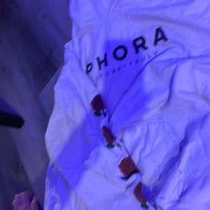 White hoodie that has red roses down the sleeve and says photos in the middle